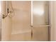 A clean and well-maintained shower featuring tile walls and a glass door at 7616 Newport Bay E Dr, Indianapolis, IN 46240