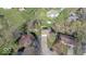 Aerial view of home nestled among trees, showcasing long driveway and surrounding neighborhood at 7733 Opelika Ct, Indianapolis, IN 46217