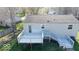 Backyard featuring a deck and patio area with a fenced yard and mature trees at 7733 Opelika Ct, Indianapolis, IN 46217