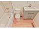 Well-lit bathroom featuring tile flooring, a toilet, and a vanity with drawers at 7733 Opelika Ct, Indianapolis, IN 46217