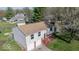 Split-level home featuring a two-car garage, brick accents, and a well-maintained front yard at 7733 Opelika Ct, Indianapolis, IN 46217