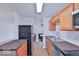 Kitchen with stainless steel appliances, wood cabinets, and wood countertop island at 7733 Opelika Ct, Indianapolis, IN 46217