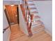 Bright stairway with wooden stairs and white risers leads to the upper level at 7733 Opelika Ct, Indianapolis, IN 46217
