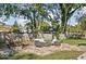 Backyard patio with stone pavers, outdoor seating, and a fire pit at 7859 N Chester Ave, Indianapolis, IN 46240