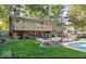 Two story house with a large deck and backyard patio next to the pool at 7859 N Chester Ave, Indianapolis, IN 46240