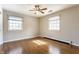 Bedroom featuring hardwood floors and two windows at 7859 N Chester Ave, Indianapolis, IN 46240