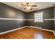 Clean and spacious bedroom with hardwood floors and neutral walls at 7859 N Chester Ave, Indianapolis, IN 46240
