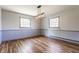 Bright dining area with wood floors, wainscoting, and modern light fixture at 7859 N Chester Ave, Indianapolis, IN 46240
