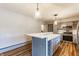 Kitchen island featuring quartz countertop and wine rack at 7859 N Chester Ave, Indianapolis, IN 46240