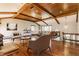 Living room boasting wood flooring, exposed wooden beams, and ample natural light at 7859 N Chester Ave, Indianapolis, IN 46240