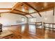 Large living room with wood floors, a wood ceiling, and a fireplace at 7859 N Chester Ave, Indianapolis, IN 46240