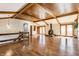 Large living room with hardwood floors, a wood ceiling, and a fireplace at 7859 N Chester Ave, Indianapolis, IN 46240