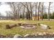 Fire pit with seating surrounded by a large yard at 8020 N Meridian N St, Indianapolis, IN 46260