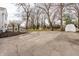 Spacious backyard featuring mature trees, lush greenery, and a concrete patio perfect for relaxing or entertaining at 8020 N Meridian N St, Indianapolis, IN 46260