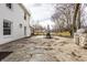 Stone patio with outdoor dining set with a grill station off to the right at 8020 N Meridian N St, Indianapolis, IN 46260