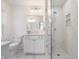Modern bathroom featuring a glass shower with marble tile and a white vanity at 8020 N Meridian N St, Indianapolis, IN 46260