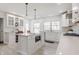 Bright, airy kitchen with white cabinets, an island, stainless steel appliances, and pendant lights at 8020 N Meridian N St, Indianapolis, IN 46260