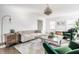Inviting living room with a tufted sofa, wooden accents, and a modern chandelier at 8020 N Meridian N St, Indianapolis, IN 46260