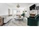 Stylish living room with a fireplace, chandelier, and modern furnishings in a bright, open space at 8020 N Meridian N St, Indianapolis, IN 46260