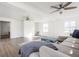 Bright living room featuring wood look floors, ceiling fans, and neutral decor at 8020 N Meridian N St, Indianapolis, IN 46260