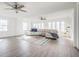 Airy living room featuring ceiling fans, lots of natural light, and neutral decor at 8020 N Meridian N St, Indianapolis, IN 46260