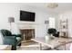 Cozy living room featuring a fireplace, hardwood floors, and elegant decor for a comfortable ambiance at 8020 N Meridian N St, Indianapolis, IN 46260