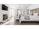 Serene main bedroom with a fireplace, TV, and French doors to an adjoining area at 8020 N Meridian N St, Indianapolis, IN 46260