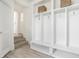 Bright mudroom boasts custom white built-in lockers for storage and organization, perfect for a Gathering at 8020 N Meridian N St, Indianapolis, IN 46260