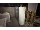 Basement utility area with two water heaters and a white washing machine visible at 8054 Harvest Ln, Indianapolis, IN 46256