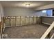 Unfinished basement area with carpet flooring and exposed wall framing at 8054 Harvest Ln, Indianapolis, IN 46256