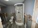 Basement bathroom with new shower and toilet partially framed with exposed studs at 8054 Harvest Ln, Indianapolis, IN 46256