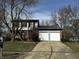 Charming two-story home with a two-car garage and a well-maintained front yard, perfect for Gathering living at 8054 Harvest Ln, Indianapolis, IN 46256