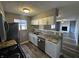 Open kitchen with granite countertops, stainless steel appliances, and wood flooring at 8054 Harvest Ln, Indianapolis, IN 46256