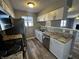 Updated kitchen with stainless steel appliances, modern countertops, and ample storage for a chef's delight at 8054 Harvest Ln, Indianapolis, IN 46256