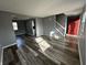 Open-concept living space featuring modern floors, fresh paint, and an inviting atmosphere at 8054 Harvest Ln, Indianapolis, IN 46256