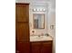 Functional bathroom vanity with stylish mirror, modern lighting, and ample storage at 810 Fabyan Rd, Indianapolis, IN 46217