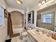 Classic bathroom with tiled shower, vanity, and well-lit mirror at 810 Fabyan Rd, Indianapolis, IN 46217