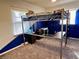 Cozy bedroom featuring a metal loft bed with integrated desk, maximizing space and functionality at 810 Fabyan Rd, Indianapolis, IN 46217
