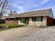 Single story home with brick and vinyl siding and a long driveway at 810 Fabyan Rd, Indianapolis, IN 46217