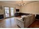 Bright living room with hardwood floors, stylish lighting, and glass doors to outdoor space at 810 Fabyan Rd, Indianapolis, IN 46217
