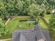 Aerial view of this house shows the large yard, playset, and fenced in yard at 859 E Bunkerhill Rd, Mooresville, IN 46158