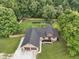 A beautiful aerial view of this home features a well-maintained lawn and a fenced backyard for outdoor enjoyment at 859 E Bunkerhill Rd, Mooresville, IN 46158