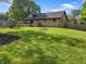 Spacious backyard featuring a playset, firepit, and grassy area at 859 E Bunkerhill Rd, Mooresville, IN 46158
