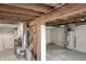 Unfinished basement featuring exposed beams, updated furnace, and water heater ready for customization at 859 E Bunkerhill Rd, Mooresville, IN 46158