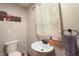 Half bathroom featuring new sink and a decorative Farm sign at 859 E Bunkerhill Rd, Mooresville, IN 46158