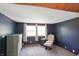 Nicely sized bedroom with large windows allowing ample natural light and a chest of drawers at 859 E Bunkerhill Rd, Mooresville, IN 46158