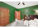 Carpeted bedroom features closet, book shelf, and white chair at 859 E Bunkerhill Rd, Mooresville, IN 46158