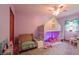 bedroom features carpet, purple walls, and a bunk bed at 859 E Bunkerhill Rd, Mooresville, IN 46158