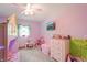 room features carpet, purple walls, bunk bed, and a TV at 859 E Bunkerhill Rd, Mooresville, IN 46158