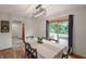 Stylish dining room with hardwood flooring, natural light, and a view to the outdoor patio at 859 E Bunkerhill Rd, Mooresville, IN 46158